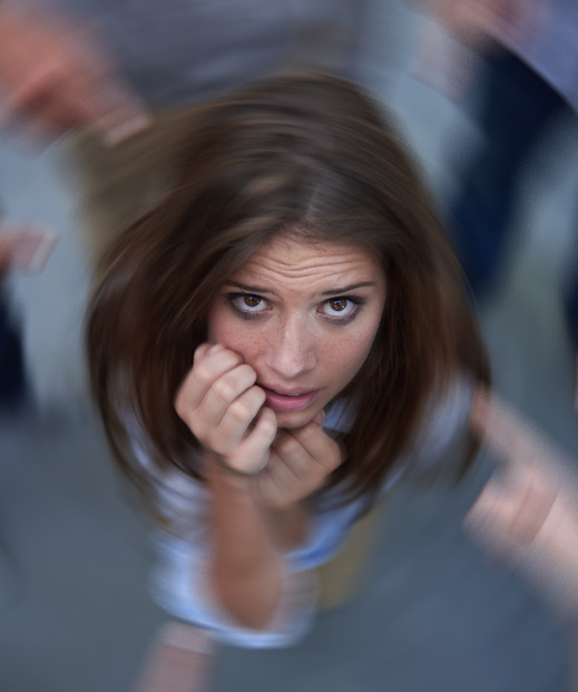 Woman looking upward, experiencing feelings of anxiety