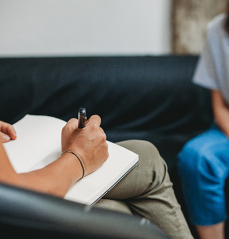 Patient and care provider talking during CBT session