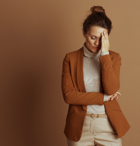 Frustrated woman touching her forehead